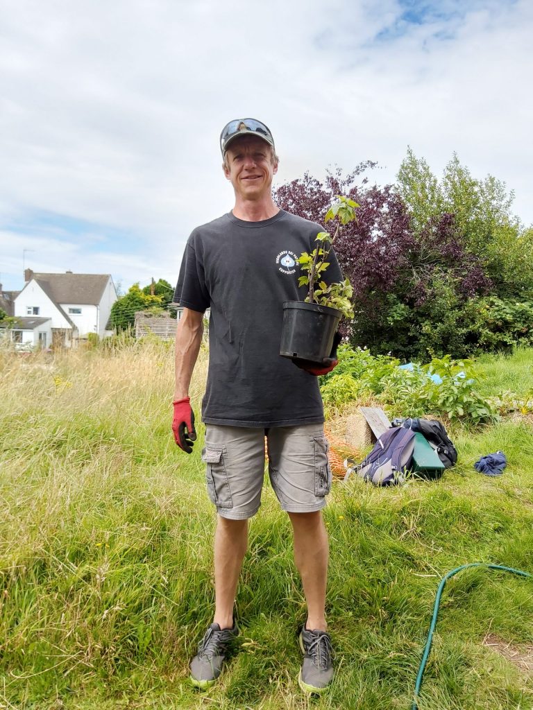 Planting at the Paganhill Community Group's community garden