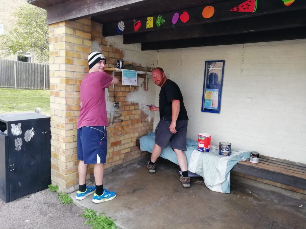 Ollie and Chris give the Bus Stop Shop a lick of paint
